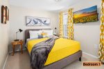 First bedroom renders a queen-sized bed with ample space for two -second floor-